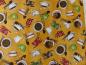 Preview: Stoff mit bunten Tassen auf gelbem Untergrund von Quilting Treasures aus der Serie Daily Grind.