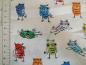Preview: Patchworkstoff von Timeless Treasures. Weiß mit bunten Fingerabdruck-Eulen.Detailansicht mit Maß.