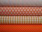 Preview: Verschiedene Baumwollstoffe in orange.