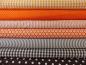 Preview: Verschiedene Baumwollstoffe in orange und braun.