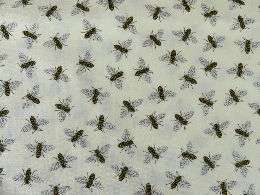 Patchworkstoff, cremefarbig mit kleinen schwarzen Bienen. Meterware.