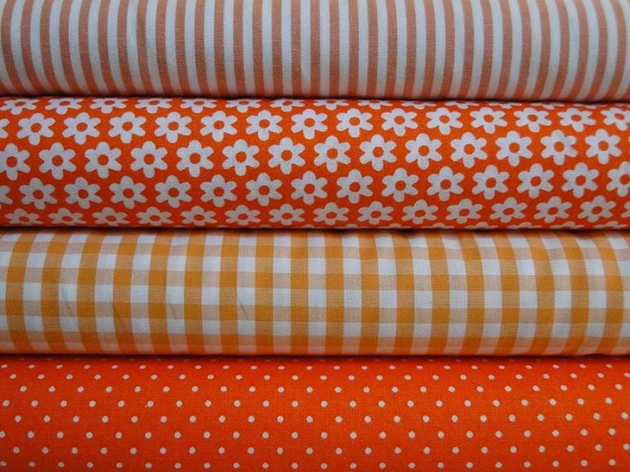 Preview: Verschiedene Baumwollstoffe in orange.