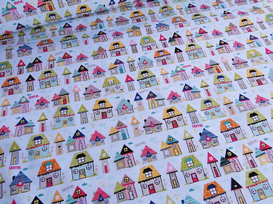 Preview: Patchworkstoff mit kleinen, bunten Häuschen auf türkisem Untergrund von Riley Blake aus der Serie Snapshot.
