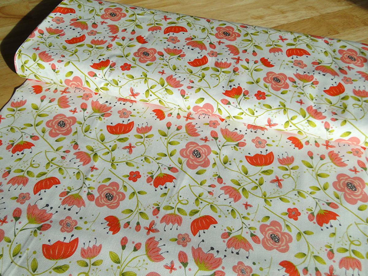Patchworkstoff, Meterware. Freundliches Muster Muster mit Blüten in rosa und rot.