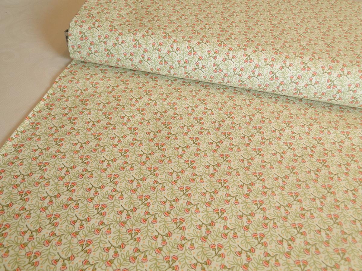 Patchworkstoff mit niedlichen, kleinen Blüten in corall und hellgrün auf creme. Von Timeless Treasures.