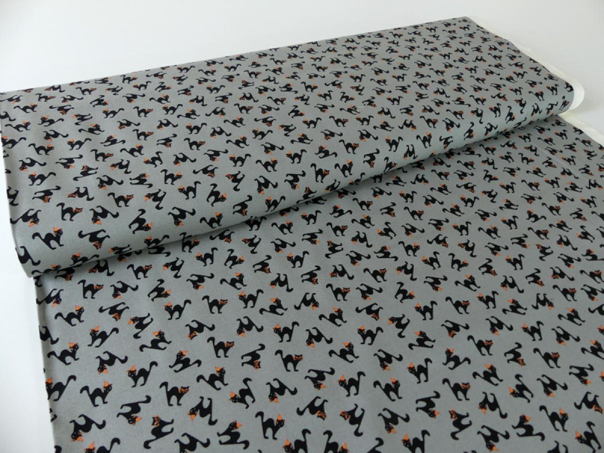 Stoff, Meterware von Moda aus der Serie Spooky Delights. Kleine schwarze Katzen auf grau.