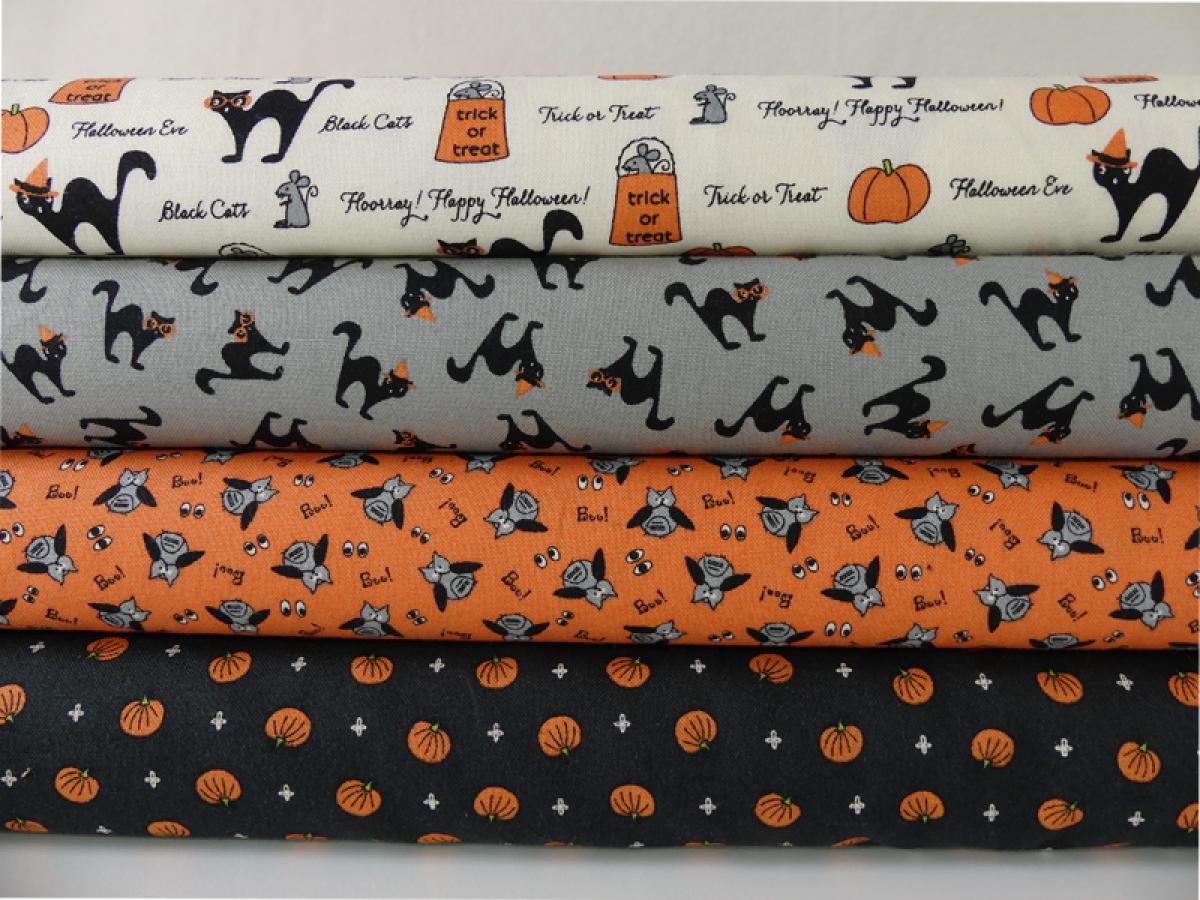 Verschiedene Patchworkstoffe aus der Serie Spooky Delights von Moda.